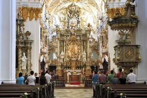 People in Rococo style chapel in Regensburg, Bavaria, Germany