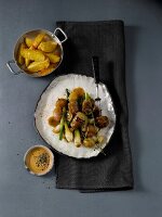 Braised lamb with spring onions and shallots, overhead view