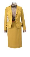 Yellow suit and silk blouse on mannequin against white background