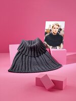 Dark gray cape with photo on pink background