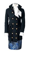 Black knitted coat over white blouse and floral patterned blue skirt on mannequin