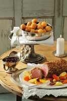 Chateaubriand with a gingerbread crust served with dried plums and croquettes