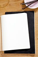 Notepad with blank pages and vanilla bean