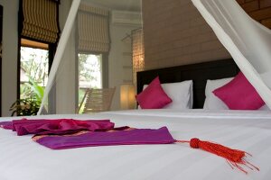 Bed in guest huts at Beluga School for Life, Thailand