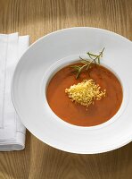 Tomato soup with millet on plate