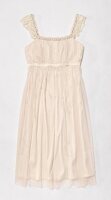 Cream coloured chiffon dress with rhinestones and pearls on white background