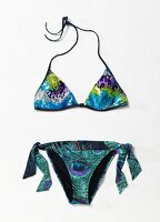 Triangle bikini with sequins trim against white background