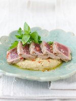 Chicken puree with tuna and sesame on plate