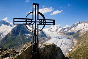Cross on Eggishorn mountain overlooking Aletsch glacier, Valais, Switzerland