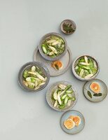 Asparagus soup and goat cheese in bowls