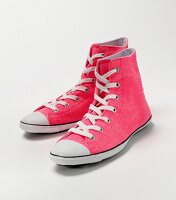 Pair of pink chucks on white background