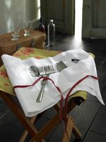 Cutlery bag on wooden stool