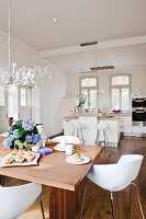 White kitchen and country-style dining area