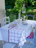 Handmade table cloth on table with chairs