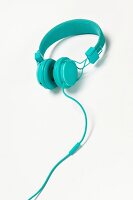 Turquoise headphones on white background