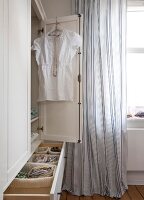 Bedrooms in Scandinavian style with wardrobe and curtains
