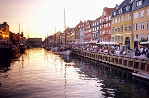 View of bars and restaurants in Nyhavn harbour in Copenhagen, Denmark