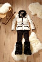 White down jacket, pants and faux fur boots on wooden floor