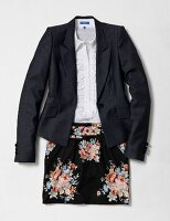 Blazer over blouse with flower print mini skirt on white background