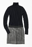 Black turtleneck sweater with gray skirt on white background