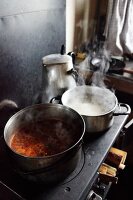 Steaming pots on a stove