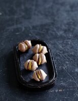 Espresso macaroons filled with caramel