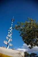 Low angle view of Maypole at the Viktualienmarkt, Munich, Germany