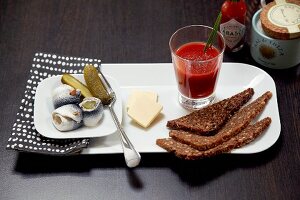 A hangover cure breakfast with rollmop herring and tomato juice