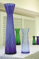 Various colourful vases made of hyacinth glass