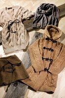 Various knitwear on wooden surface