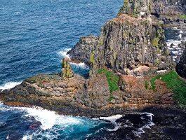 View of waves splashing on rocky cliffs at Rathlin Island, Ireland, UK