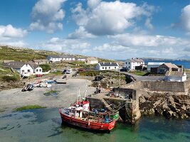 Fishing boats moored at Inishturk harbour, Ireland, UK