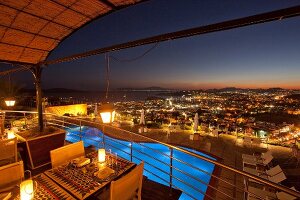 View of restaurant Tuti in Mamara hotel with cityscape at night in Istanbul, Turkey