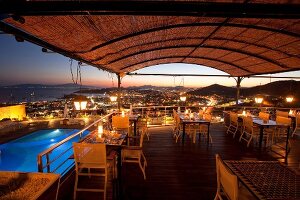 View of restaurant Tuti in Mamara hotel with cityscape at night in Istanbul, Turkey