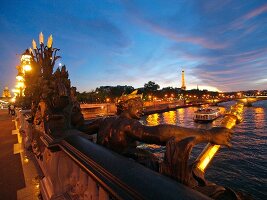 Pont Alexandre III over Seine river in night lights in Paris, France