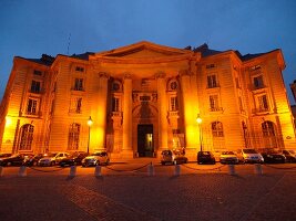 Illuminated Pantheon facade at night in Paris, France