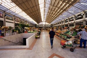 People walking in market hall of Lisbon