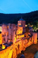Illuminated castle ruin in the evening, Heidelberg, Germany