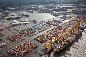 Elevated view of cargo containers and boat at port in Bremerhaven, Bremen, Germany