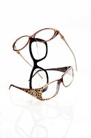 Noble, pure and wild eyeglass frames on white background