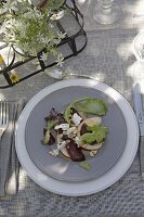 Beetroot salad with hazelnuts and goat cheese on plate
