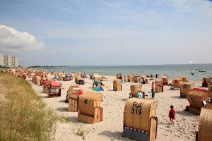 Hooded beach chairs on Baltic coast in Fehmarn, Schleswig-Holstein, Germany