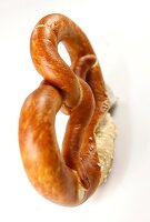 Close-up of pretzel against white background