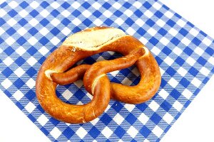 Pretzel cut at edge on checked napkin