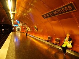 Senior woman waiting at Arts et Metiers metro station in Paris, France