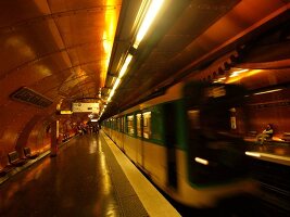 Senior woman waiting at Arts et Metiers metro station in Paris, France