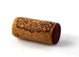 Cork of red wine bottle on white background