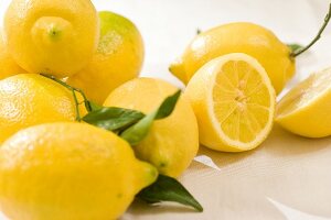 Close-up of whole and halved lemons
