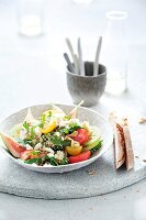 Bulgur salad with tomato and feta cheese in bowl
