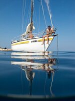 Two men on sailing boat in Croatia